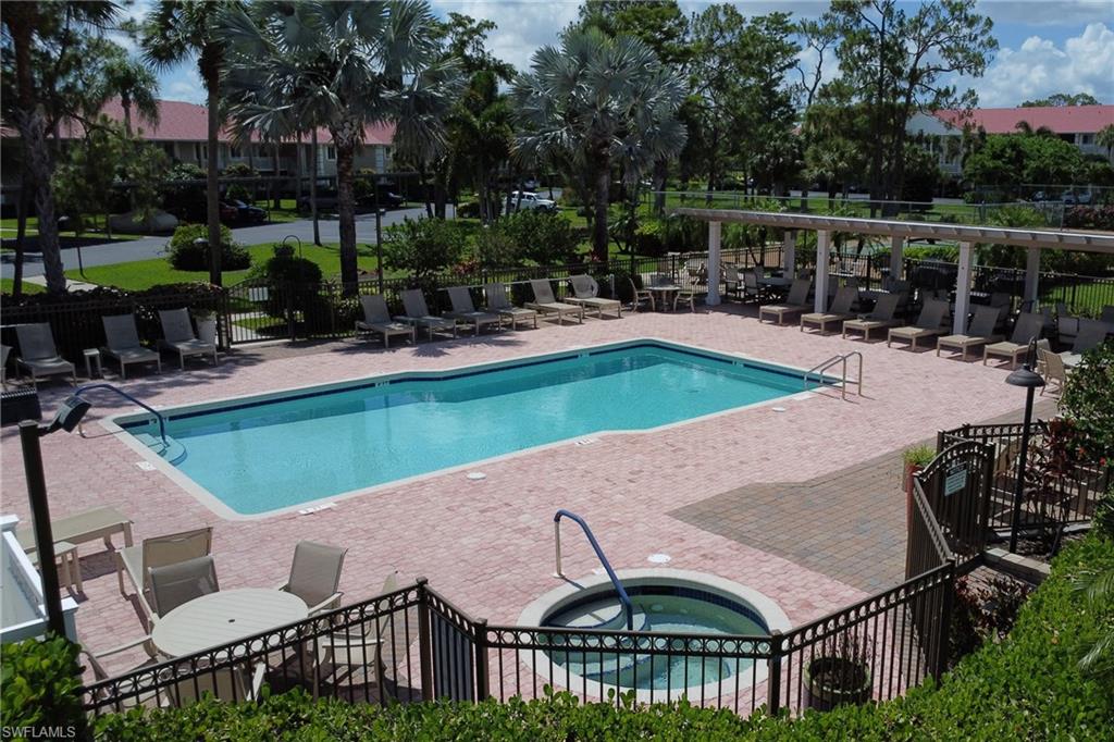 4556 Andover Way, Unit E106 Naples, FL 34112 - Photo 32 of 40 Community pool with a patio and a community hot tub