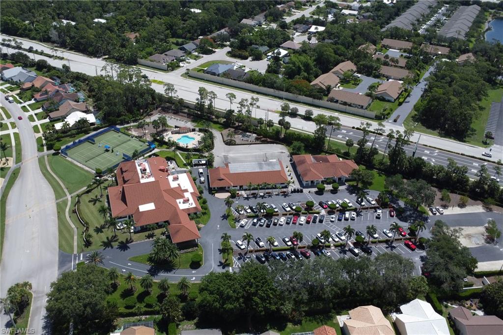 4556 Andover Way, Unit E106 Naples, FL 34112 - Photo 5 of 40 Aerial view of property and surrounding area featuring nearby suburban area