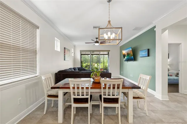 a view of walk in closet with clothes