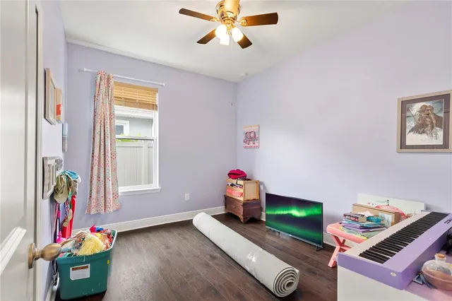 an aerial view of residential houses with outdoor space and lake view