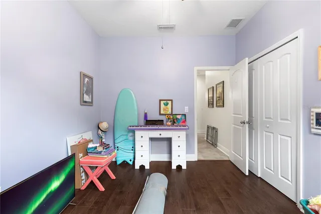 an aerial view of residential houses with outdoor space and swimming pool