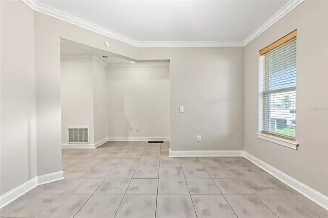 a kitchen with stainless steel appliances granite countertop sink stove top oven dining table and chairs