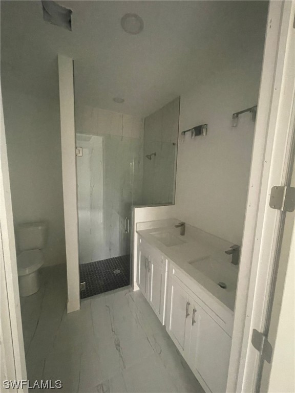 2524 39th Street West Lehigh Acres, FL 33971 - Photo 6 of 9 a bathroom with a granite countertop sink a toilet and shower