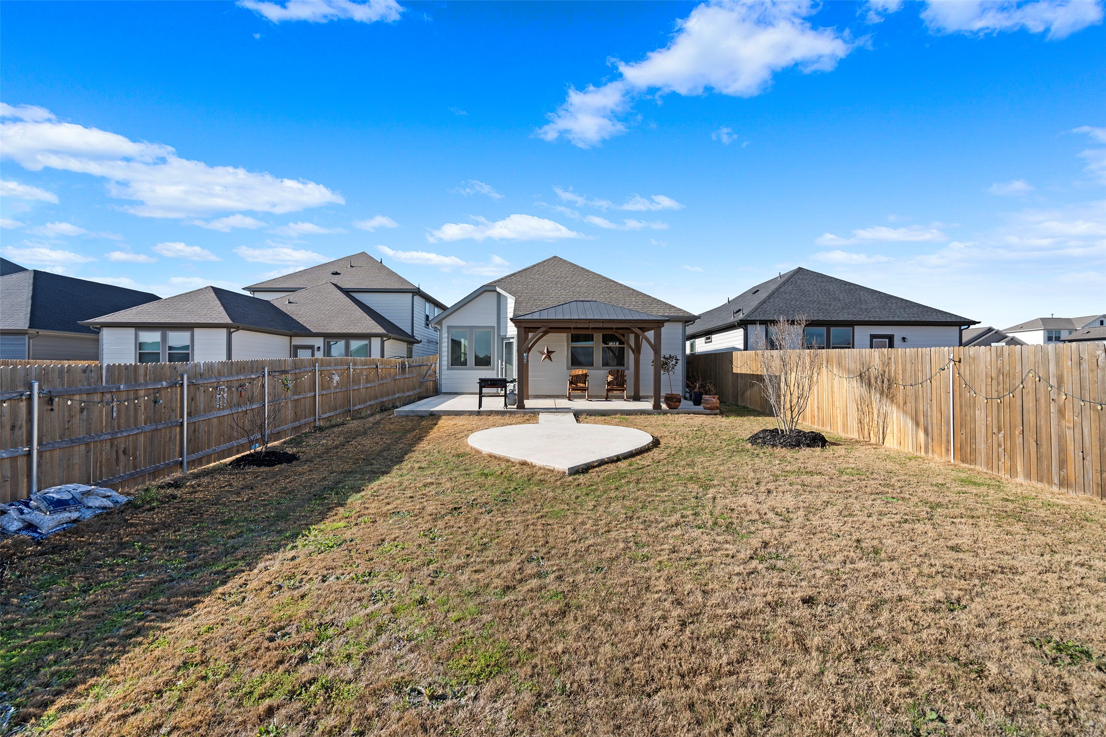 172 Gullivers Drive Elgin, TX 78621 - Photo 11 of 25 a front view of a house with a yard