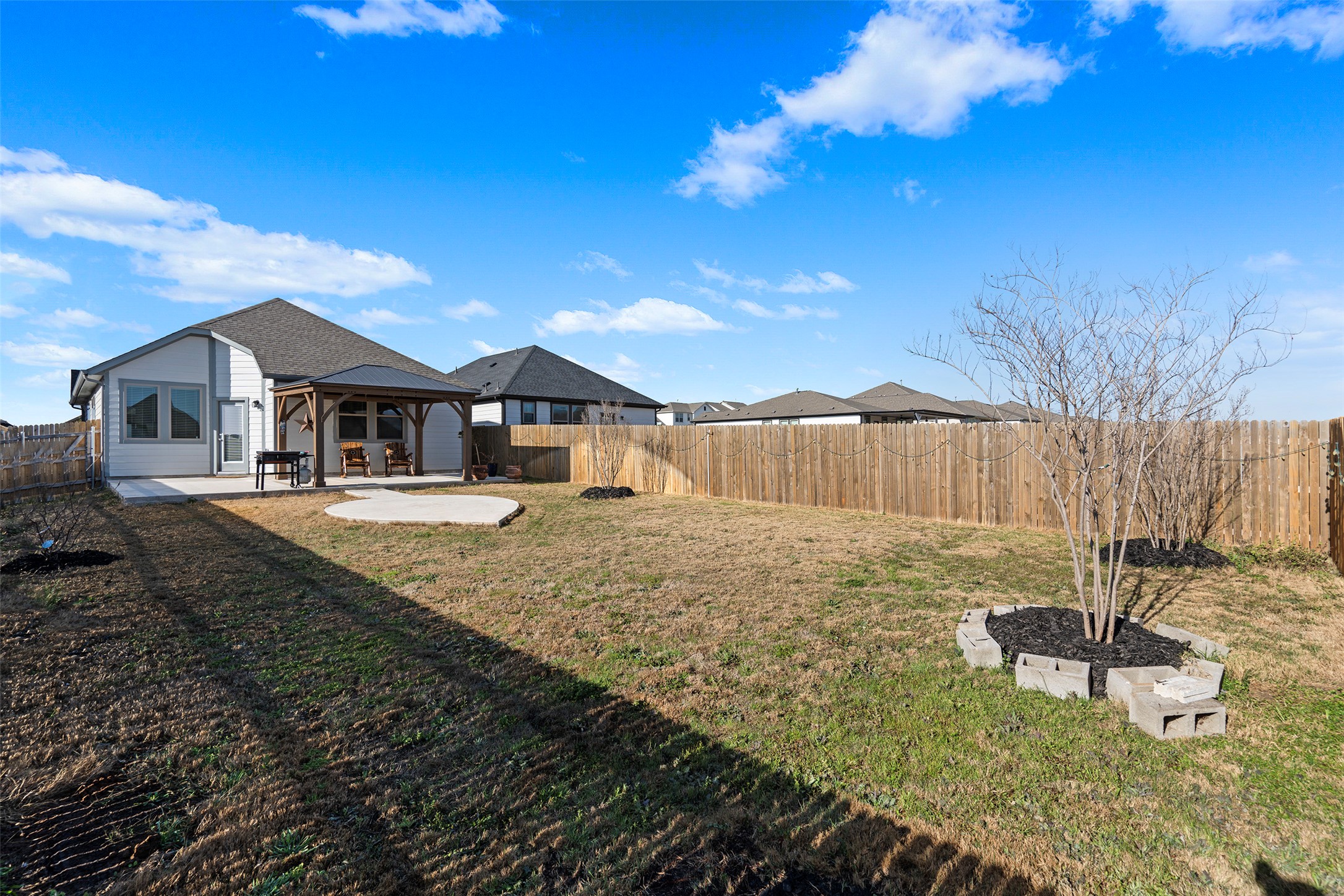 172 Gullivers Drive Elgin, TX 78621 - Photo 12 of 25 a house view with a backyard space