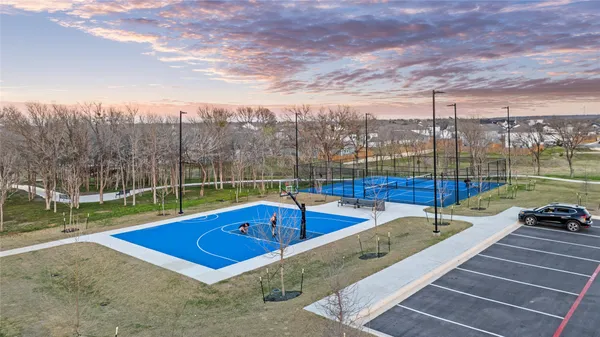 a view of a swimming pool with a yard and sitting area