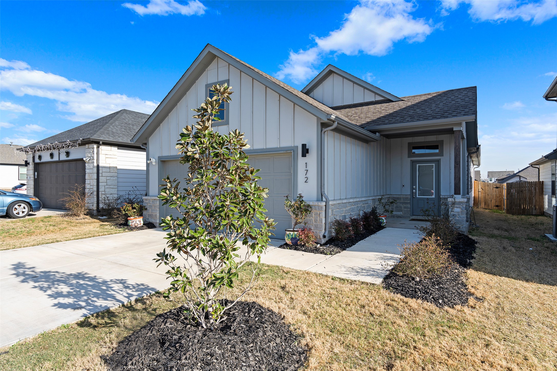 172 Gullivers Drive Elgin, TX 78621 - Photo 3 of 25 a front view of a house with a yard