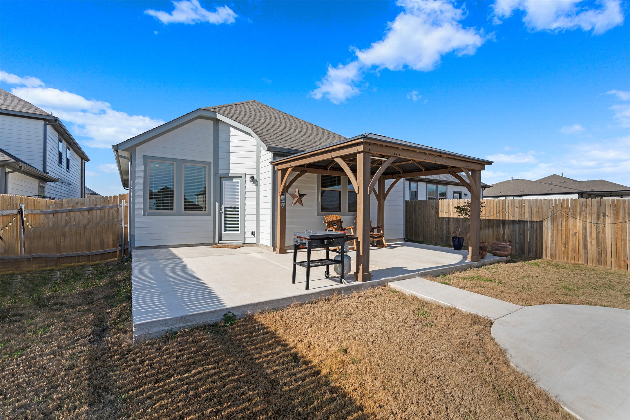 172 Gullivers Drive Elgin, TX 78621 - Photo 6 of 25 a view of a house with wooden floor and a yard