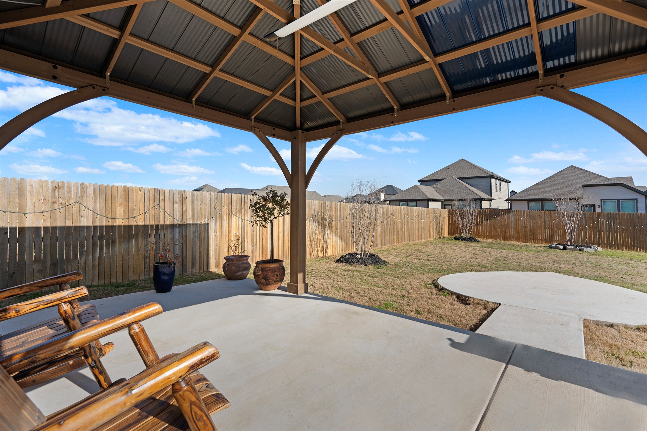 172 Gullivers Drive Elgin, TX 78621 - Photo 7 of 25 a view of a backyard with a tub