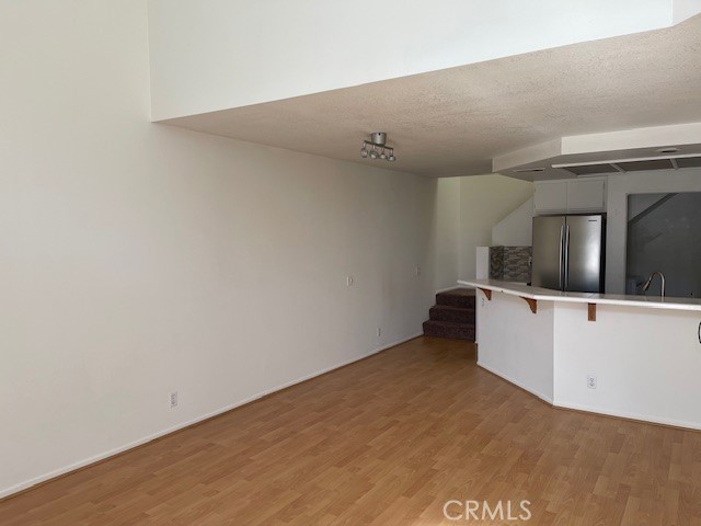 73 Fallingstar Irvine, CA 92614 - Photo 13 of 34 a view of cabinets and wooden floor