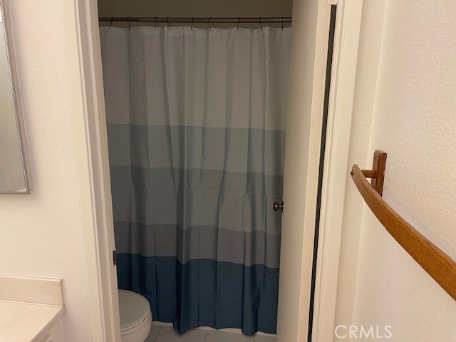 73 Fallingstar Irvine, CA 92614 - Photo 23 of 34 a bathroom with a shower curtain
