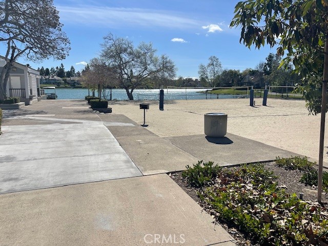 73 Fallingstar Irvine, CA 92614 - Photo 32 of 34 a view of a lake with a bench and trees around