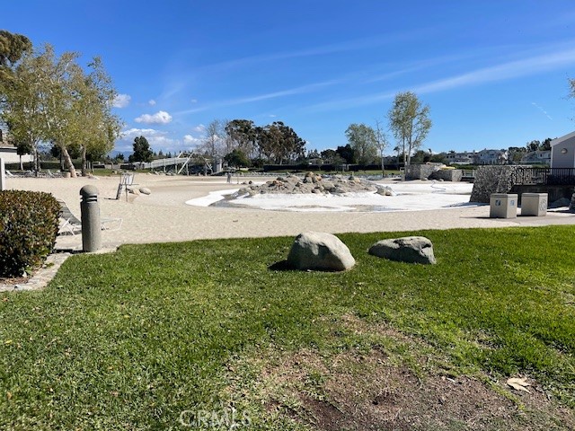 73 Fallingstar Irvine, CA 92614 - Photo 33 of 34 a view of a lake with a building and trees in the background