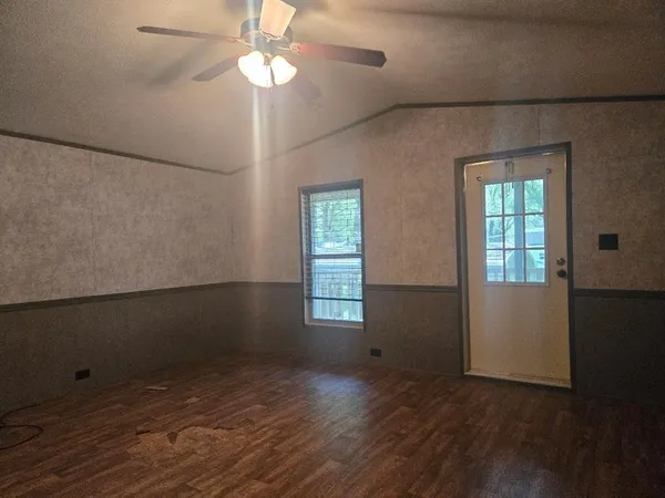 a kitchen with kitchen island a sink stainless steel appliances and cabinets