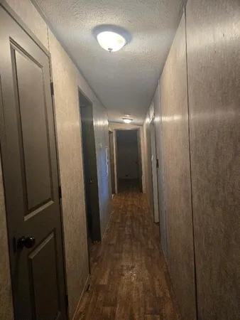 a bedroom with a bed and a night stand