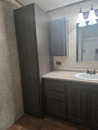 a white toilet sitting next to a shower