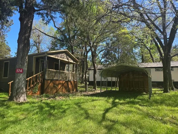 a view of a house with a small yard