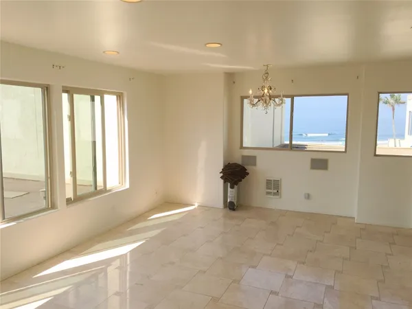 a kitchen with a cabinets and white appliances