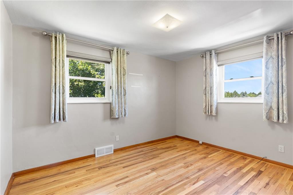 1017 Silver Lane McKees Rocks, PA 15136 - Photo 16 of 34 a view of empty room with wooden floor and fan