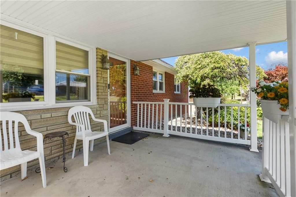 1017 Silver Lane McKees Rocks, PA 15136 - Photo 2 of 34 a porch with a bench in front of house