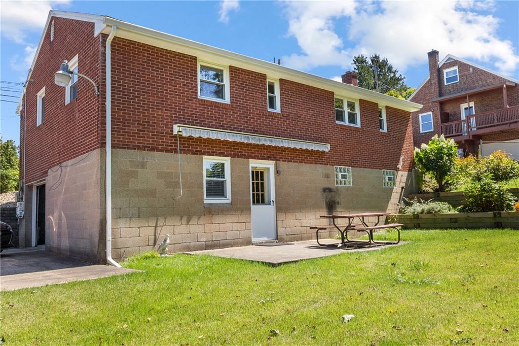 1017 Silver Lane McKees Rocks, PA 15136 - Photo 27 of 34 a view of a house with backyard sitting area and garden