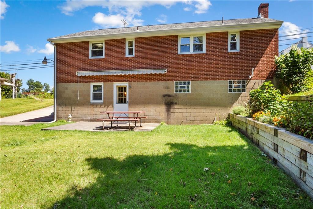 1017 Silver Lane McKees Rocks, PA 15136 - Photo 28 of 34 a front view of a house with swimming pool having outdoor seating