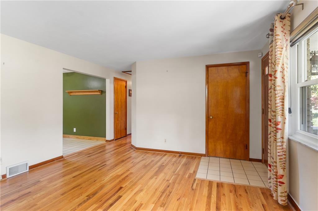 1017 Silver Lane McKees Rocks, PA 15136 - Photo 6 of 34 an empty room with closet and wooden floor