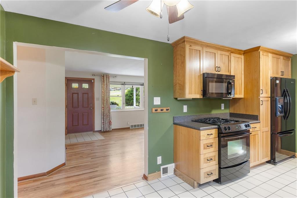 1017 Silver Lane McKees Rocks, PA 15136 - Photo 7 of 34 a kitchen with stove cabinets and refrigerator