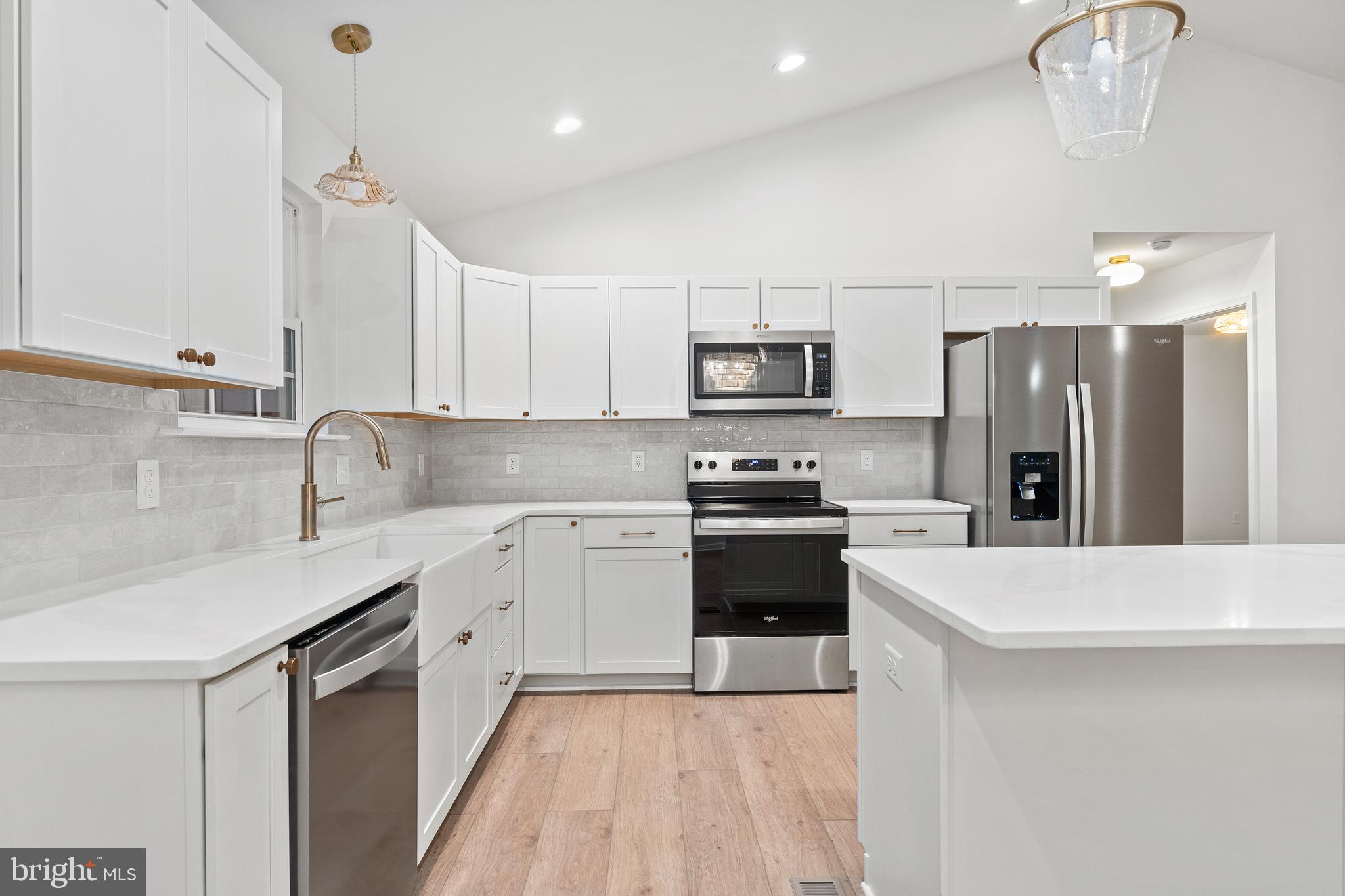 1080 Eastham Road Bumpass, VA 23024 - Photo 11 of 43 a kitchen with stainless steel appliances a sink stove and refrigerator