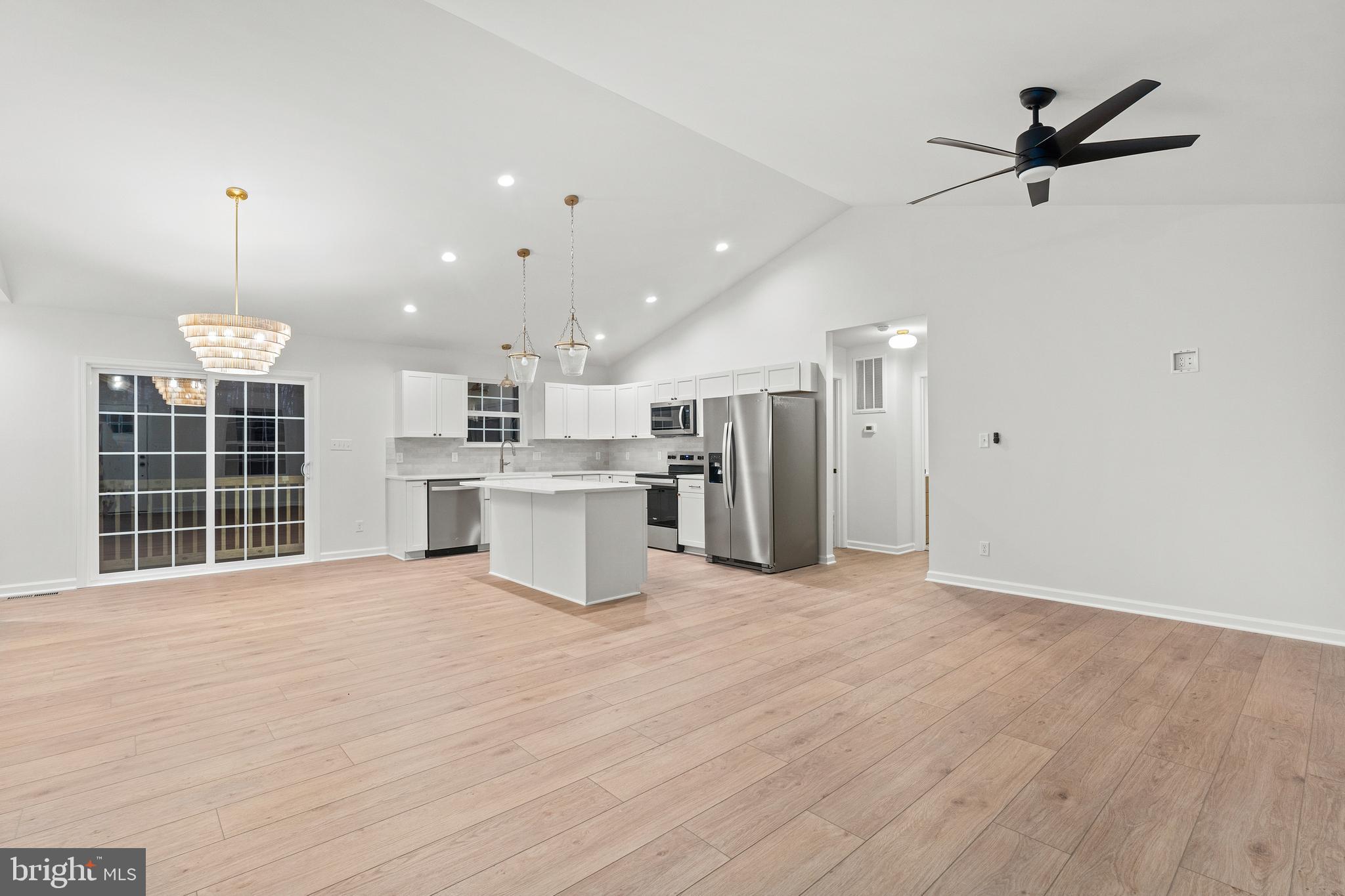 1080 Eastham Road Bumpass, VA 23024 - Photo 2 of 43 a view of a kitchen with a sink and a refrigerator