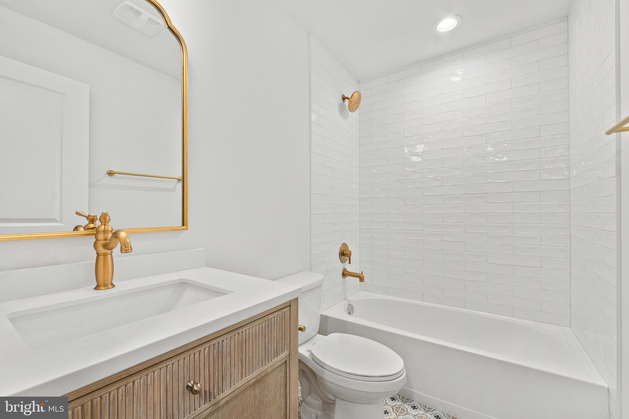 1080 Eastham Road Bumpass, VA 23024 - Photo 28 of 43 a bathroom with a sink a toilet and shower