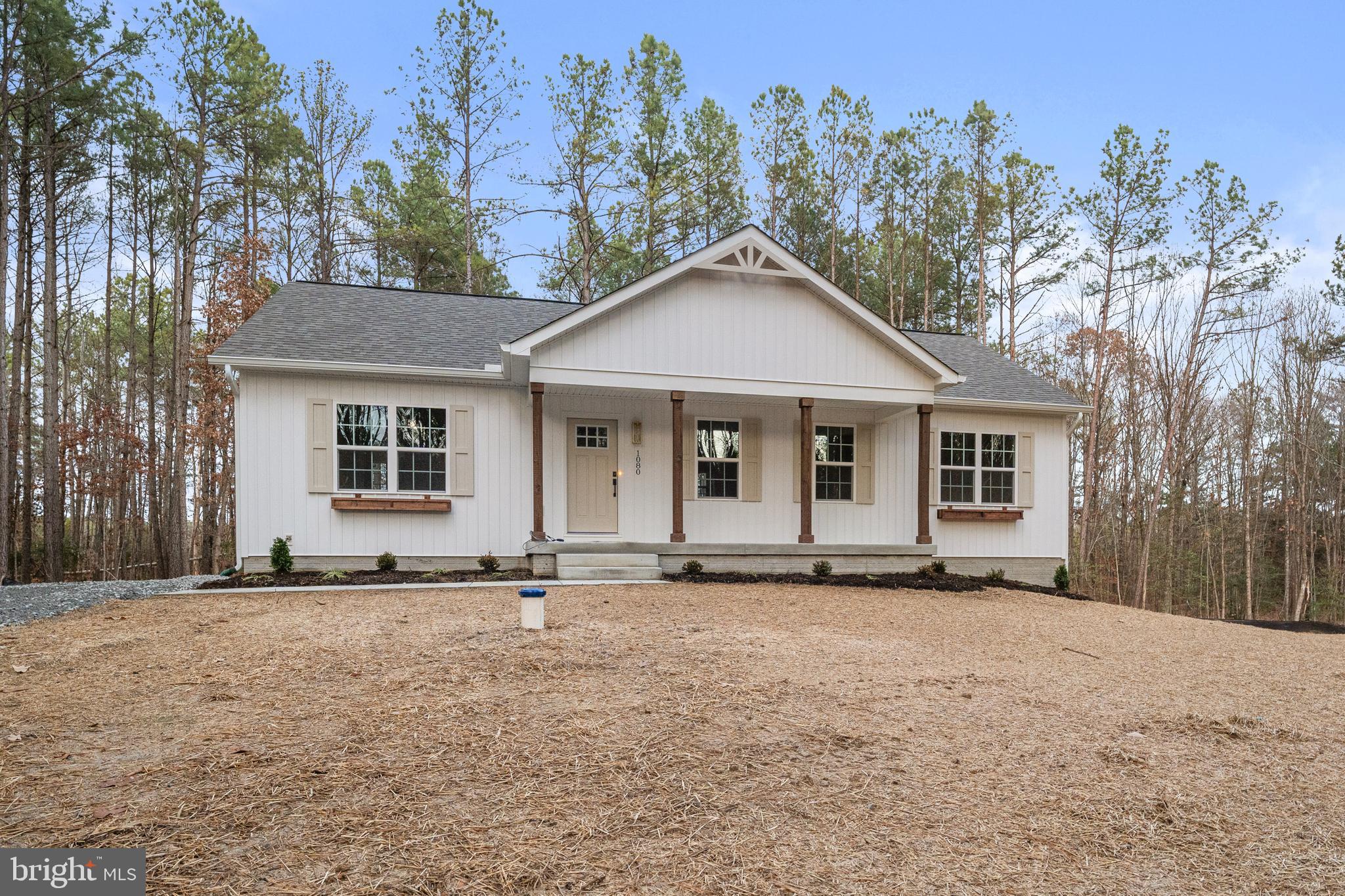 1080 Eastham Road Bumpass, VA 23024 - Photo 36 of 43 front view of a house with a yard