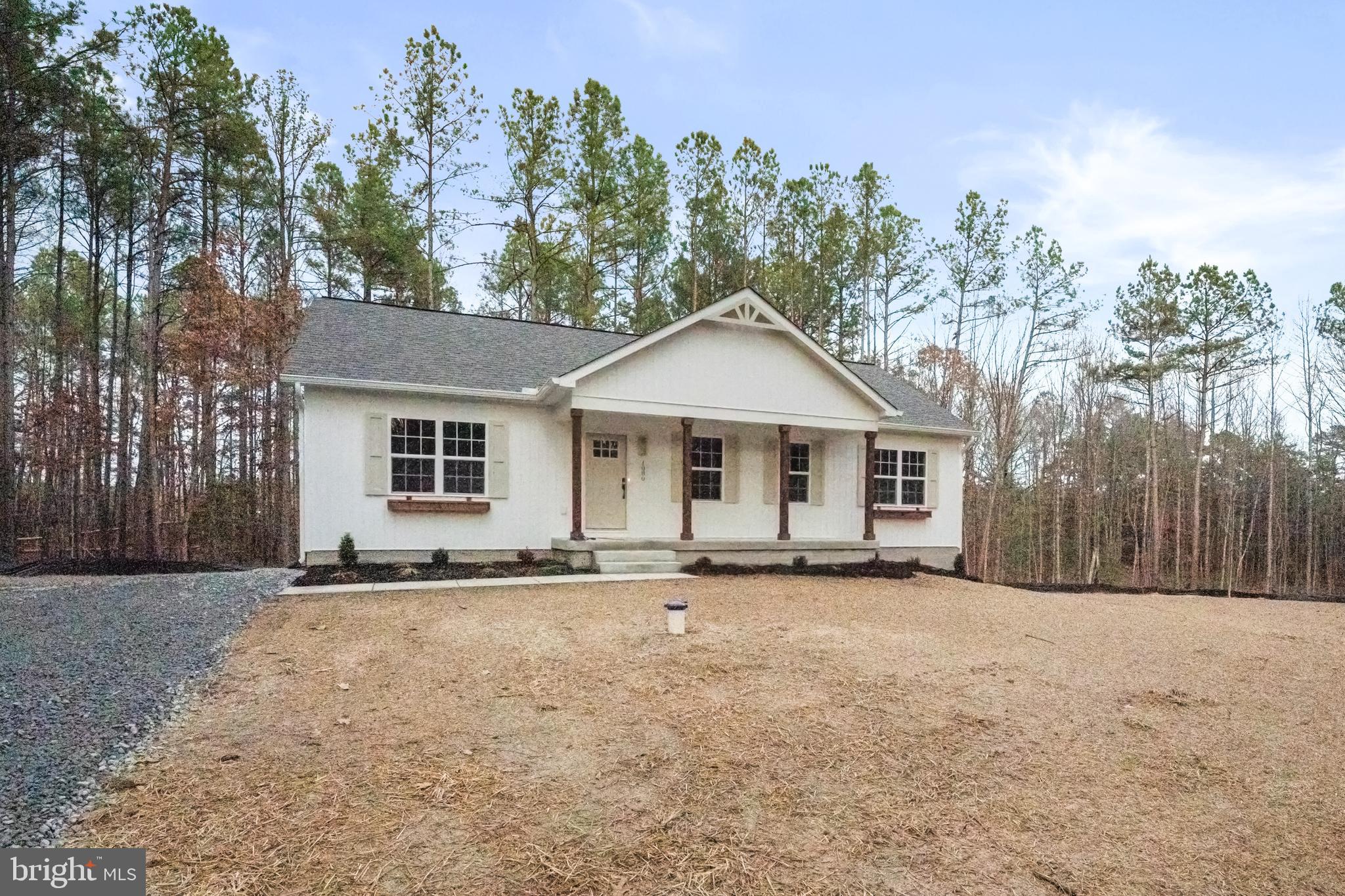 1080 Eastham Road Bumpass, VA 23024 - Photo 37 of 43 a front view of a house with a yard