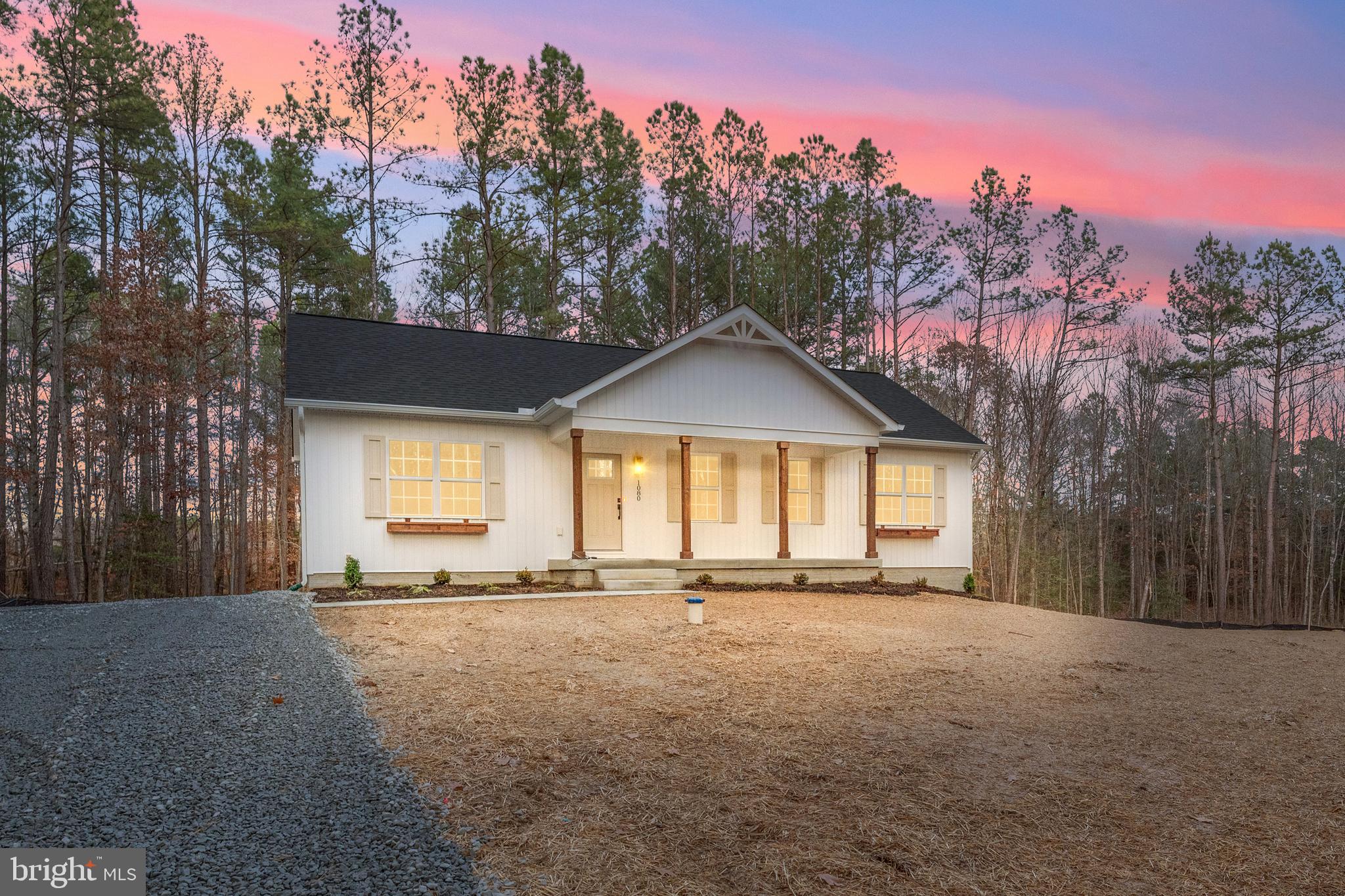 1080 Eastham Road Bumpass, VA 23024 - Photo 38 of 43 a view of a house with a yard and a large tree
