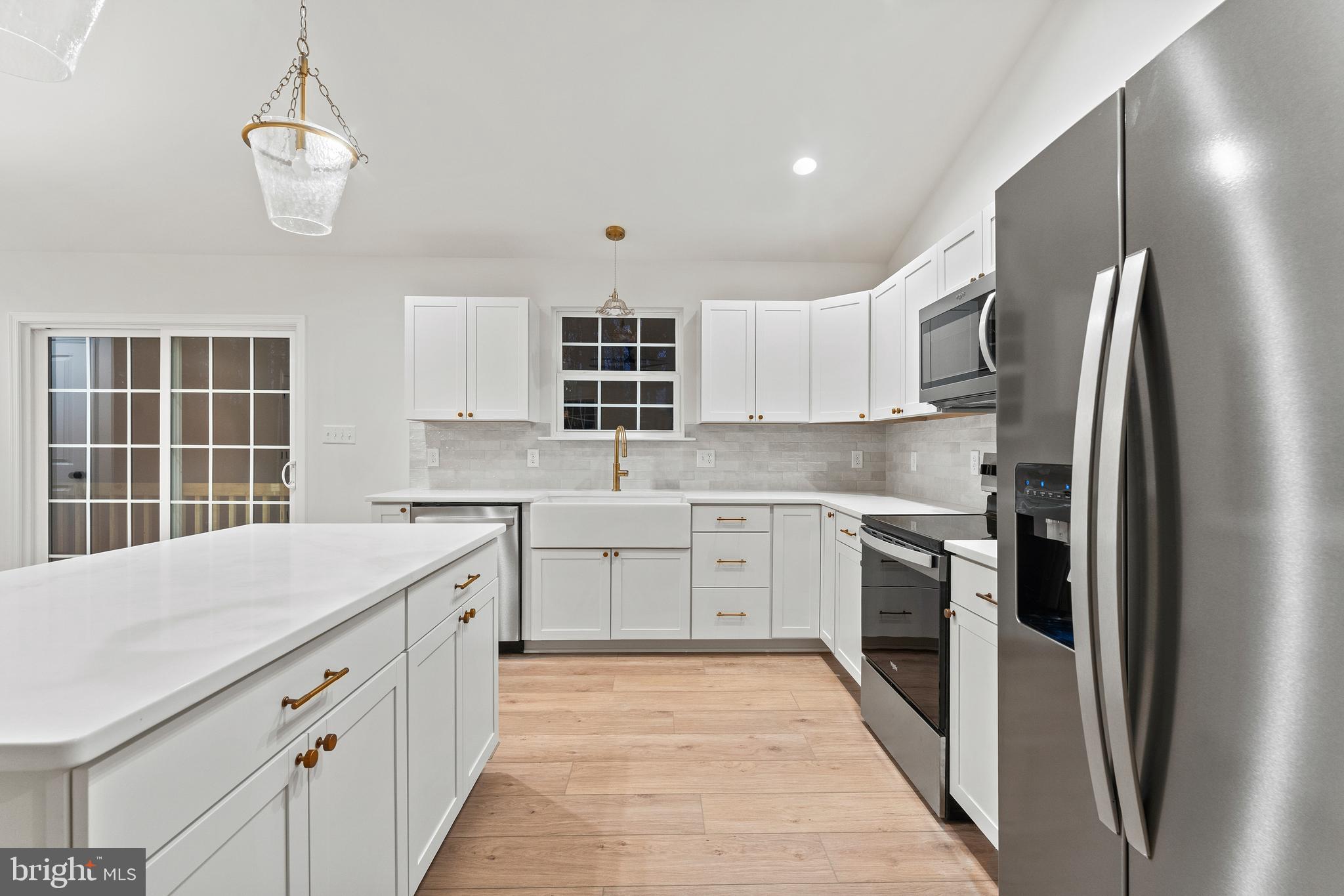 1080 Eastham Road Bumpass, VA 23024 - Photo 7 of 43 a kitchen with stainless steel appliances granite countertop a sink stove and refrigerator