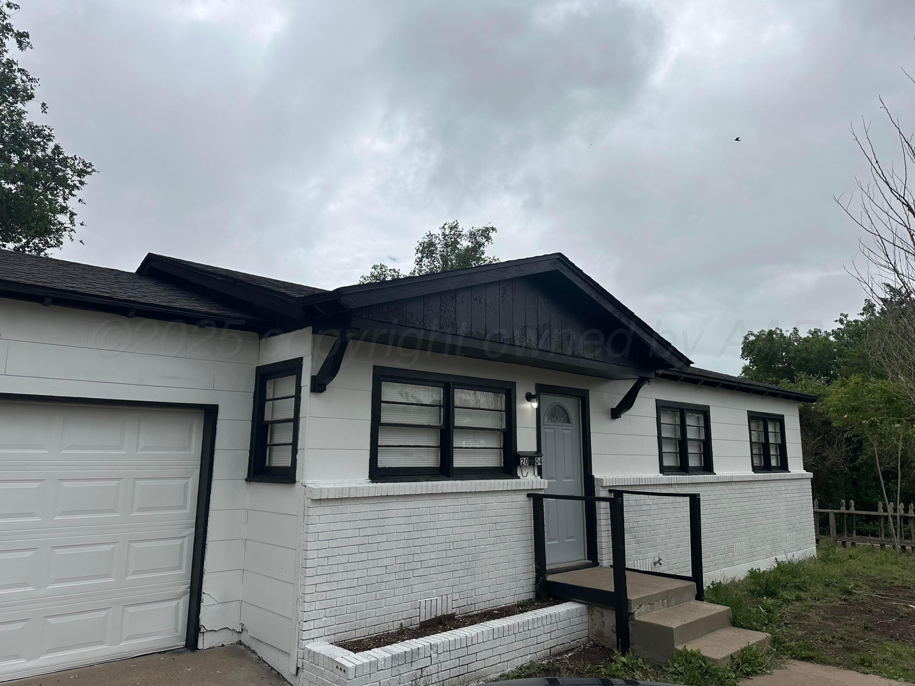 0 Portfolio Package Amarillo, TX 79110 - Photo 2 of 17 a front view of a house with a yard