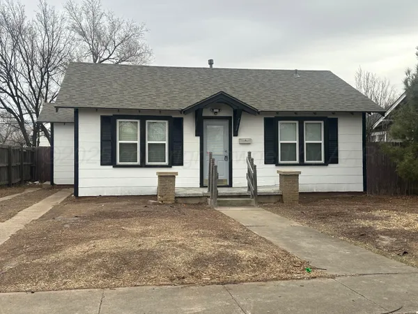 a house with trees in the background