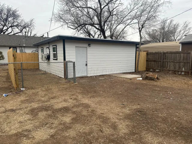 a view of a house with a street