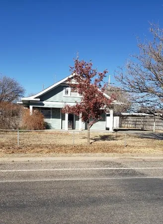 a house that has a window in front of it