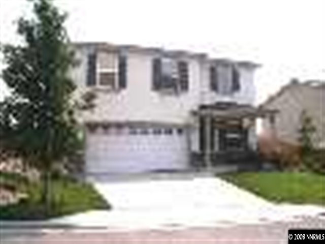 9275 Red Baron Boulevard Reno, NV 89506 - Photo 1 of 9 a front view of a house with a yard