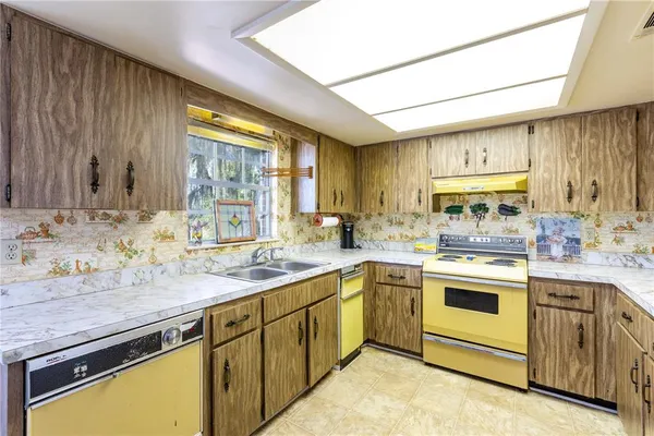 a view of a kitchen area with furniture and chandelier