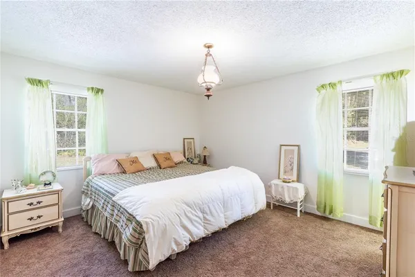 a room with furniture and flat screen tv