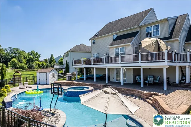 a kitchen with stainless steel appliances wooden cabinets and a stove top oven