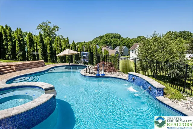 a kitchen with granite countertop wooden cabinets a dining table and chairs with wooden floor