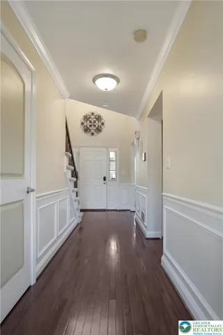 a kitchen with stainless steel appliances granite countertop wooden cabinets a sink and a stove