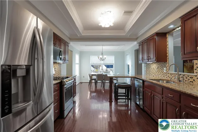 a spacious bedroom with a bed and a lamp