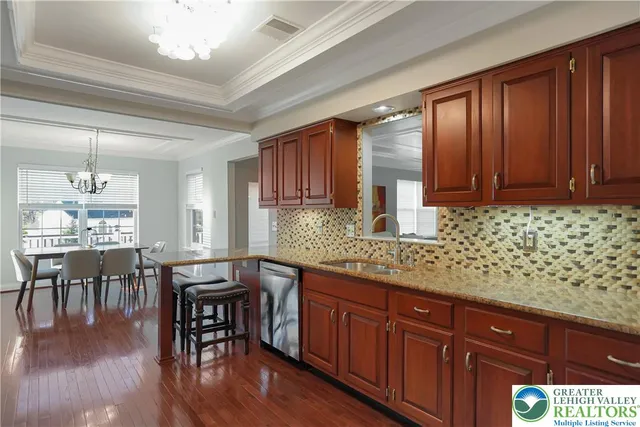 a white toilet sitting next to a sink
