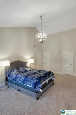 a view of a house with swimming pool and a yard