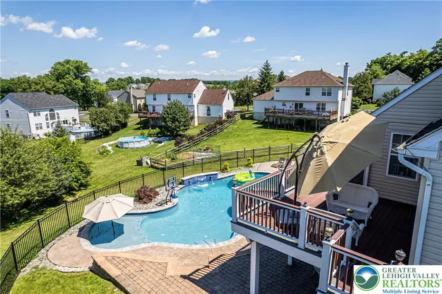 a kitchen with stainless steel appliances wooden cabinets and a stove top oven
