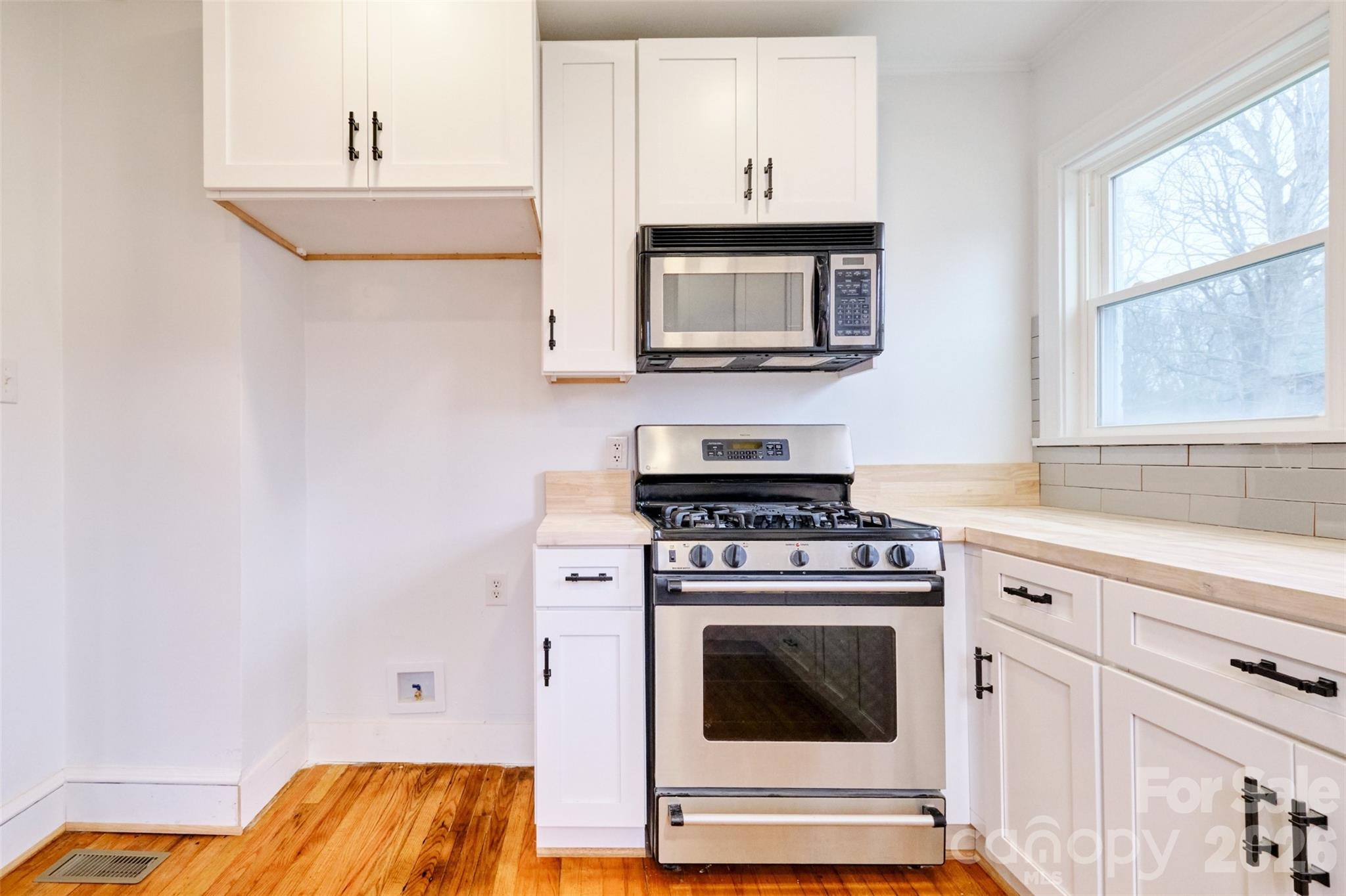 804 Congress Street North York, SC 29745 - Photo 11 of 48 a kitchen with a stove and a microwave